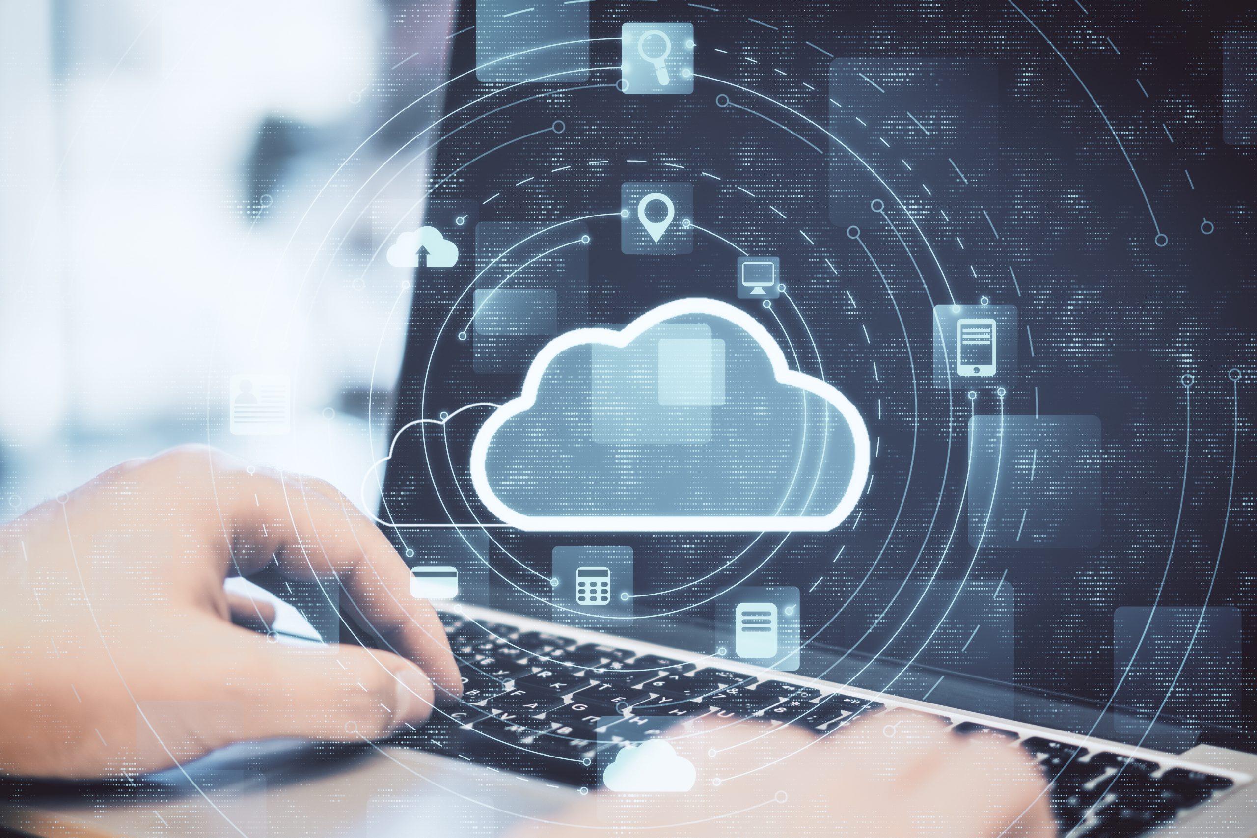 Hand using laptop with cloud computing diagram